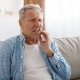 Portrait of unhappy mature man suffering from toothache